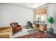 Home office with a large window, desk, and comfortable seating area, perfect for remote work at 8236 Round Hills Cir, Las Vegas, NV 89113