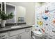 Bathroom featuring a vanity with a quartz countertop and a colorful shower curtain at 832 Canonbury St, Henderson, NV 89011