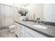 Bright bathroom featuring a white vanity, quartz countertop, and patterned shower curtain at 832 Canonbury St, Henderson, NV 89011