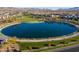 Aerial view of a scenic community lake surrounded by walking paths and lush landscaping at 832 Canonbury St, Henderson, NV 89011