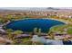 Community lake featuring green spaces, walking paths, and scenic mountain views at 832 Canonbury St, Henderson, NV 89011