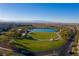 Beautiful community park featuring a serene lake, green lawns, and scenic walking paths at 832 Canonbury St, Henderson, NV 89011