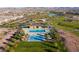 Community pool and splash pad with covered seating and landscaping for a luxurious outdoor experience at 832 Canonbury St, Henderson, NV 89011