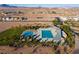 Community pool and recreation area with modern design, shaded areas and mountain views at 832 Canonbury St, Henderson, NV 89011