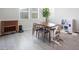 Cozy dining area with a wooden table, chairs, and natural light from the windows at 832 Canonbury St, Henderson, NV 89011