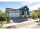 Charming single-story home featuring a brick driveway, a two-car garage, and a well-manicured front yard at 832 Canonbury St, Henderson, NV 89011