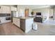 Open-concept kitchen featuring stainless steel appliances, a kitchen island, and modern finishes at 832 Canonbury St, Henderson, NV 89011