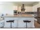 Modern kitchen with a center island, stainless steel appliances, and bar stool seating at 832 Canonbury St, Henderson, NV 89011