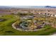 Scenic community park featuring walking paths, playground, landscaping, and mountain views at 832 Canonbury St, Henderson, NV 89011