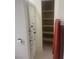 Bathroom featuring a shower with fish themed curtain and built in open storage shelves at 9365 Sparkling Waters Ave, Las Vegas, NV 89129