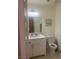 Bathroom featuring a white vanity with modern fixtures, a mirror and a toilet at 9365 Sparkling Waters Ave, Las Vegas, NV 89129