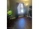 Bedroom featuring hardwood floors, dark curtains and an aquarium stand with fish tank at 9365 Sparkling Waters Ave, Las Vegas, NV 89129