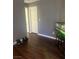 Bedroom highlighting hardwood floors, gray walls, and an aquarium stand with fish tank at 9365 Sparkling Waters Ave, Las Vegas, NV 89129