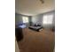 Bedroom with carpet, two windows, and fan at 9365 Sparkling Waters Ave, Las Vegas, NV 89129