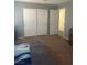 Spacious bedroom with large closet and neutral color palette and carpet at 9365 Sparkling Waters Ave, Las Vegas, NV 89129