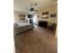 Bedroom with neutral carpet, ceiling fan, ample storage, and a calm atmosphere for restful sleep at 9365 Sparkling Waters Ave, Las Vegas, NV 89129