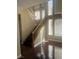 Entryway features hardwood floors, soaring ceilings, and a staircase leading to the second floor at 9365 Sparkling Waters Ave, Las Vegas, NV 89129