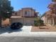 Charming two-story home features a well-manicured front yard and a spacious three-car garage at 9365 Sparkling Waters Ave, Las Vegas, NV 89129