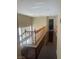 Second-floor hallway featuring wood floors, natural light, and access to multiple rooms in the house at 9365 Sparkling Waters Ave, Las Vegas, NV 89129