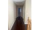 Bright upstairs hallway featuring hardwood floors, neutral walls, and access to different rooms at 9365 Sparkling Waters Ave, Las Vegas, NV 89129