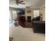Cozy living room featuring a fireplace, hardwood floors and a sliding glass door at 9365 Sparkling Waters Ave, Las Vegas, NV 89129