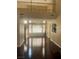 Open living area featuring hardwood floors, high ceilings, and a wall of windows at 9365 Sparkling Waters Ave, Las Vegas, NV 89129