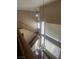 View of the staircase with wood banister and tall windows offering lots of natural light at 9365 Sparkling Waters Ave, Las Vegas, NV 89129