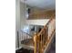 Bright staircase with wood railing and an open floor plan, adding warmth to the home's design at 9365 Sparkling Waters Ave, Las Vegas, NV 89129