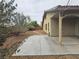 Serene backyard with a covered patio, desert landscaping, and a stone walkway perfect for relaxing at 9462 Alhambra Valley St, Las Vegas, NV 89178