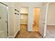An angled bathroom view, highlighting a glass-walled shower, toilet room and a walk-in closet at 9462 Alhambra Valley St, Las Vegas, NV 89178