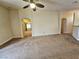 Open living room showing neutral carpeting and views to other rooms at 9462 Alhambra Valley St, Las Vegas, NV 89178