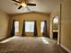 Generously sized main bedroom with neutral carpet, ensuite bathroom, and three large windows at 9462 Alhambra Valley St, Las Vegas, NV 89178
