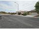 Neighborhood street view showcasing the home's proximity to the community gate at 9462 Alhambra Valley St, Las Vegas, NV 89178