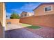 A fully fenced backyard with a stone patio and low-maintenance landscaping at 9535 Stills Way, Las Vegas, NV 89148
