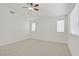 Large bedroom with lots of natural light, carpet floors, and a ceiling fan creating a relaxing and bright space at 9535 Stills Way, Las Vegas, NV 89148