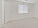 Bedroom showcasing neutral carpet, bright white walls, and a window at 9535 Stills Way, Las Vegas, NV 89148