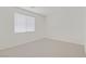 Neutral bedroom features plush carpeting and a bright window at 9535 Stills Way, Las Vegas, NV 89148