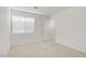 Bright bedroom with window, carpet, and a doorway at 9535 Stills Way, Las Vegas, NV 89148