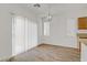 Dining area with sliding door and modern chandelier at 9535 Stills Way, Las Vegas, NV 89148