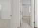 Hallway showing access to a bedroom with plush neutral carpet at 9535 Stills Way, Las Vegas, NV 89148