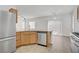 Open kitchen featuring modern appliances, ample counter space, and seamless flow to dining area at 9535 Stills Way, Las Vegas, NV 89148
