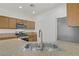 Bright kitchen featuring stainless steel appliances, wooden cabinets, and stone countertops at 9535 Stills Way, Las Vegas, NV 89148