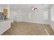 Open living space with modern floors seamlessly connecting to the kitchen at 9535 Stills Way, Las Vegas, NV 89148