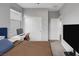 Bedroom showcases a comfortable bed, desk area, and closet space, perfect for a restful retreat at 9876 Heather Moore Ave, Las Vegas, NV 89166