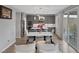 Open floor plan with dining area, kitchen, and outdoor access, perfect for entertaining and relaxation at 9876 Heather Moore Ave, Las Vegas, NV 89166