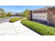 Elegant stone entrance to the Ridgeview community with lush landscaping and well-maintained grounds at 9876 Heather Moore Ave, Las Vegas, NV 89166