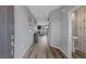 Bright entryway with hardwood floors leading to an open living space with a staircase at 9876 Heather Moore Ave, Las Vegas, NV 89166
