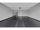 A spacious garage with a sleek, epoxy floor, offering a clean and functional space for vehicles and storage at 9876 Heather Moore Ave, Las Vegas, NV 89166