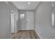 Clean, neutral-toned hallway featuring modern lighting and hardwood flooring at 9876 Heather Moore Ave, Las Vegas, NV 89166
