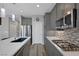 Modern kitchen featuring stainless steel appliances, quartz countertops, and gas range at 9876 Heather Moore Ave, Las Vegas, NV 89166